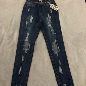 Very distressed denim skinny jeans